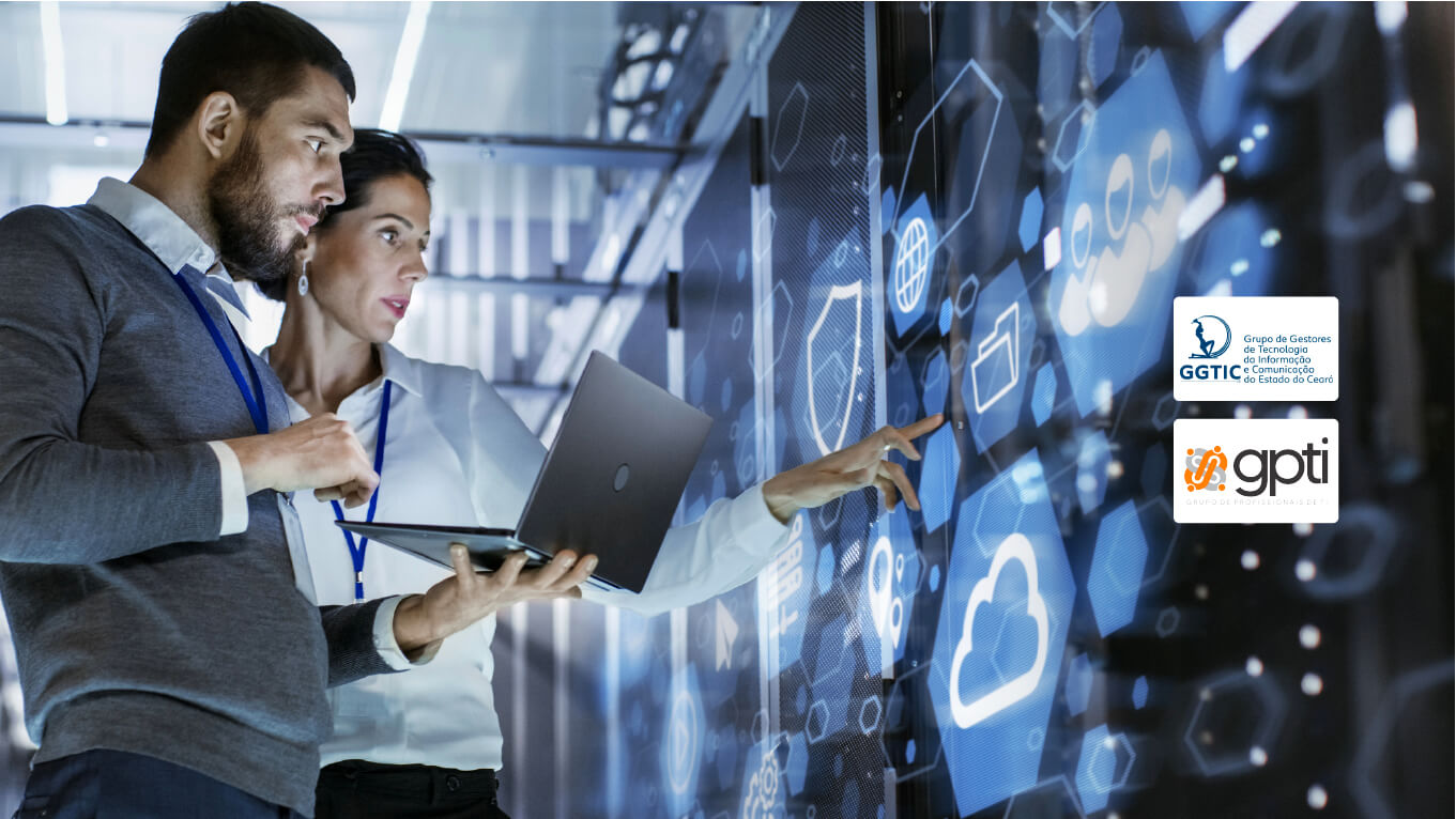 Um homem e uma mulher estão num data center, analisando os serviços do ambiente